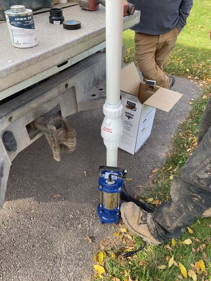 New septic effluent pump with check valve assembled before installation in Cocagne, NB