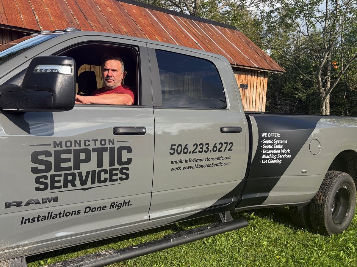 Moncton Septic Services Ram 3500 truck in Ceramic Grey, used for septic system installations in southeastern New Brunswick